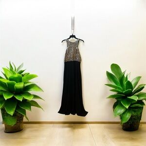 Black with silver long dress, has been used once and it’s in good condition.